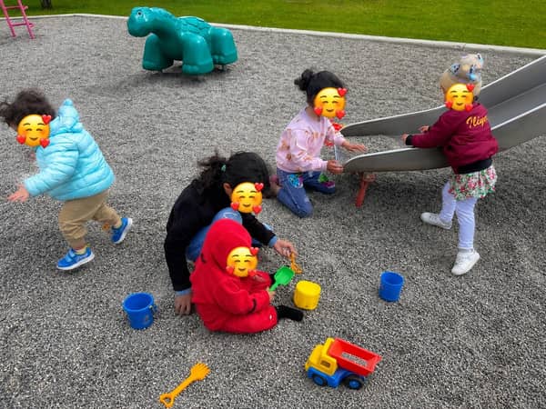 Children playing outdoors at Tiny Oaks Day Home